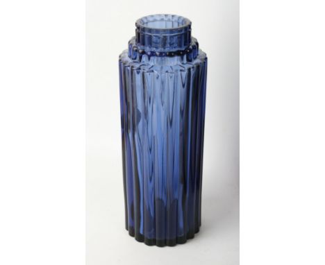 A Lalique France moulded glass 'Worth' perfume bottleOf cylindrical form with ribbed decoration, moulded marks to base, heigh