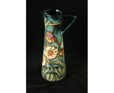 A modern Moorcroft pottery limited edition jug of slender formDecorated with stylised foliate on a light blue ground, by Kerr