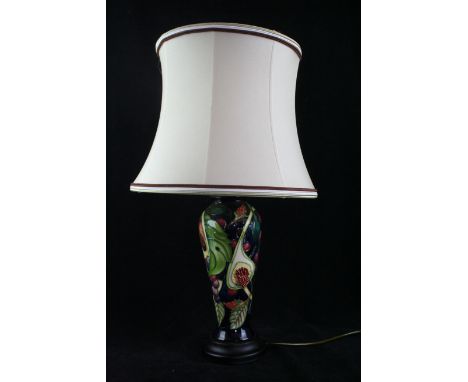 A modern Moorcroft table lamp Of tapering cylindrical form, decorated in the 'Queens Choice' pattern, designed by Emma Bosson