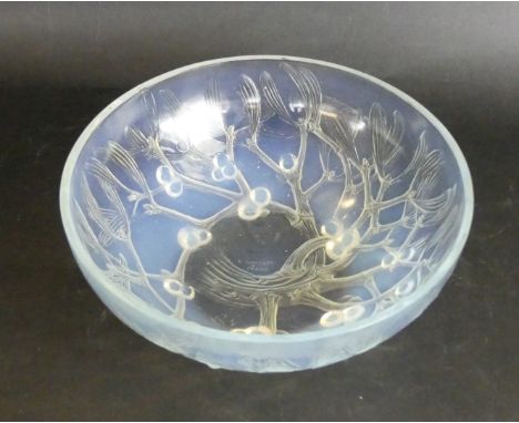 A Rene Lalique opalescent glass bowlOf circular form, decorated in the 'Mistletoe' pattern, signed and numbered 3223 to base,