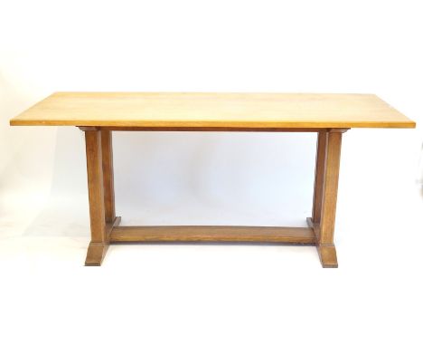 An Arts & Crafts Heal & Son light oak Letchworth refectory tableRaised on block supports, length 184m.    CONDITION REPORT:  