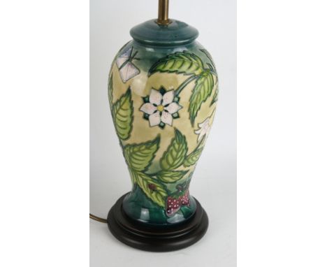 A modern Moorcroft pottery table lampOf inverted baluster form, decorated with butterflies and foliate, height (excluding fit