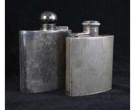 Two Art Deco hallmarked silver hip flasksEach having engine turned decoration, one example Birmingham 1941, second example ma