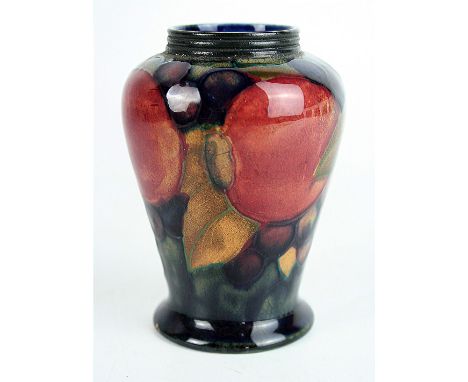 A Walter Moorcroft vase of shouldered formDecorated in the 'Pomegranate' pattern on a blue and green ground, impressed factor