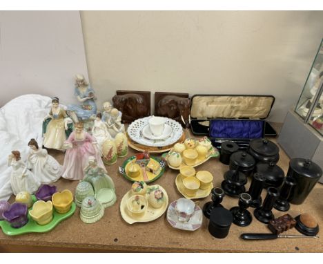 A pair of elephant bookends together a Carltonware cruet, other cruets, Royal Doulton figures, silver handled sewing set, ebo