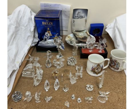 A collection of Swarovski crystal, including Fabulous Creatures, The Dragon, a stork, harp, horses, ship, birds and animals t