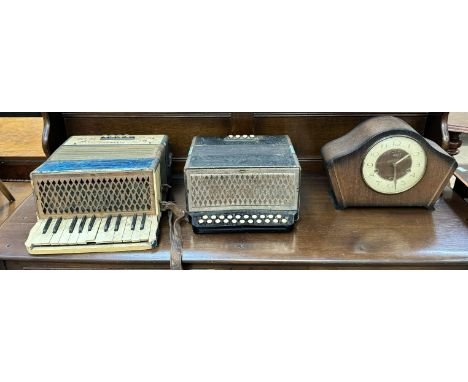 A Hohner Student piano accordion together with another Hohner accordion and an oak mantle clock