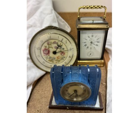 A Rapport of France brass carriage clock, with an alarm dial with push button repeat together with a blue glass clock and ano