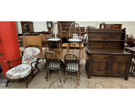 An Ercol dining table and six chairs, includes a pair of elbow chairs together with a dresser and another elbow chair  CONDIT