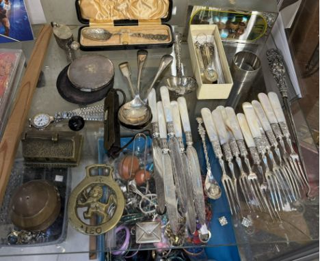 A silver spoon together with a Sterling stamp case, mother of pearl handled fruit set, brasswares etc