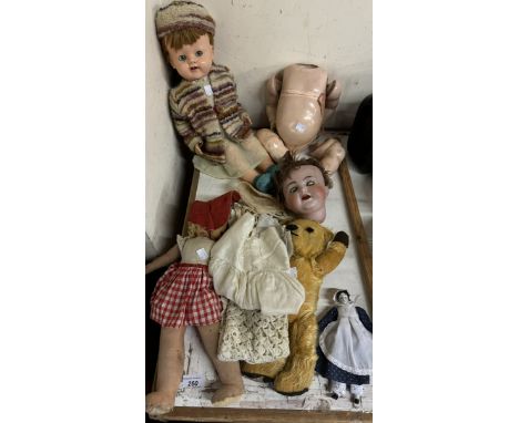 A Kammer & Reinhardt, Simon & Halbig bisque head doll together with three other dolls and a teddy bear