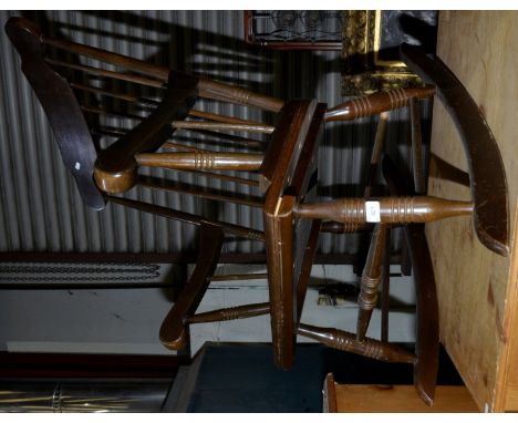 Stained pine stick back rocking chair  