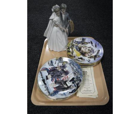 A Nao figure - bride and groom and a set of eight RAF collector's plates with certificates 