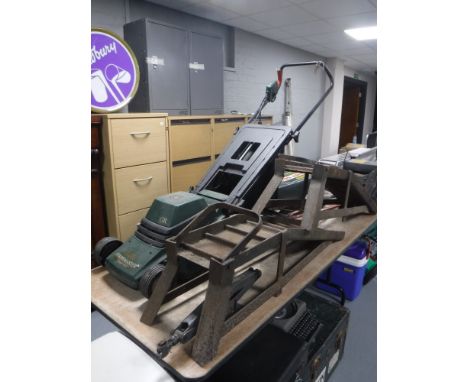 Two metal car ramps, car jack, bench top vice, bundle of garden tools and a Black & Decker mower with lead 