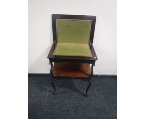 A Victorian mahogany foldover card table  