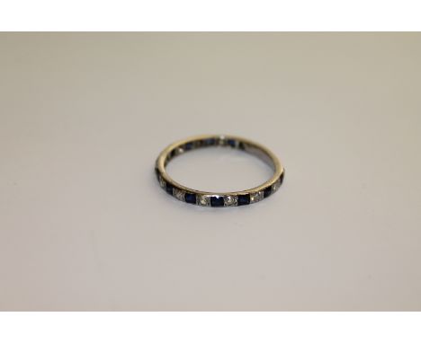 An 18ct white gold sapphire and diamond eternity ring