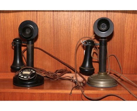 Two vintage candlestick telephones.
