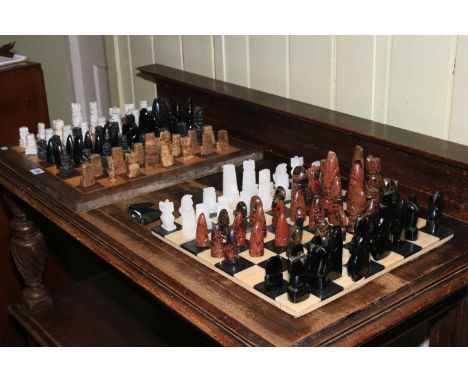Two chess boards and chess pieces.