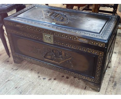 Carved Eastern camphorwood trunk, 55cm by 102cm by 54cm.