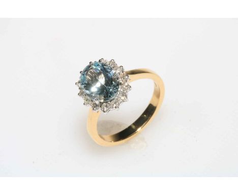 Diamond and aquamarine cluster ring set in 18 carat gold aquamarine total 2.25, diamonds totalling 0.38 carats, size N.