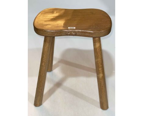 Robert Thompson 'Mouseman' four legged shaped top stool, 45cm by 37cm by 30cm.