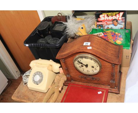 Cameras and lenses, Bakelite telephone, Action Man, mantel clock, annuals, etc.