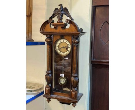 Victorian walnut cased Vienna style wall clock with phoenix crest.