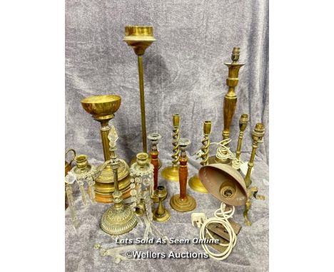 Collection of brass lamps and candle holders including a pair of twisted candle sticks, vintage desk lamp and three armed can