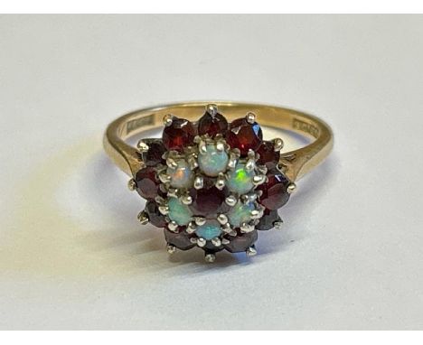 Opal and garnet cluster ring stamped 9ct gold. Ring size M, gross weight 3.89g / SF 