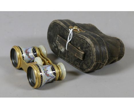 A pair of lacquered brass opera glasses in case with engine turned enamel decoration. Condition Report. To be used as a guide