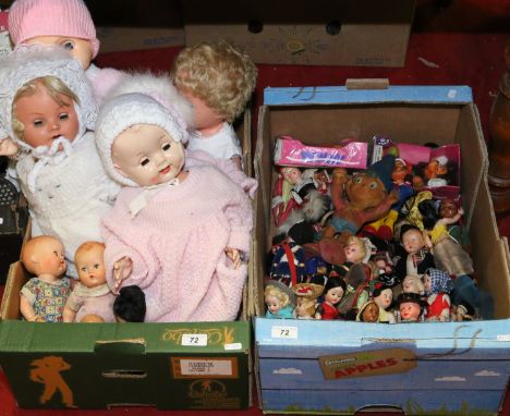 Two boxes of vintage dolls and novelty bendy toys.