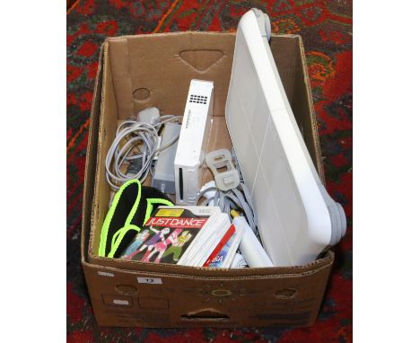A Nintendo Wii games console, along with balance board and five games.