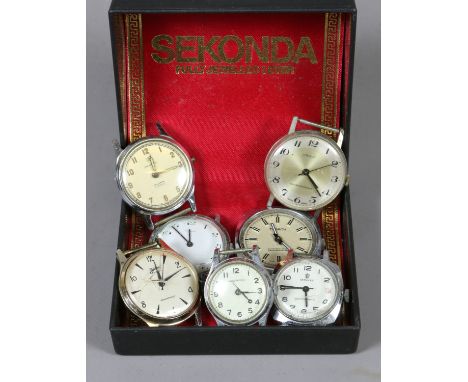 A collection of various watch heads to include Timex and Ingersol examples.