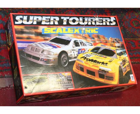 A boxed Scalextric super tourers set to include cars, power unit, track etc.
