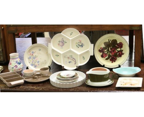 A collection of various Poole pottery items.
