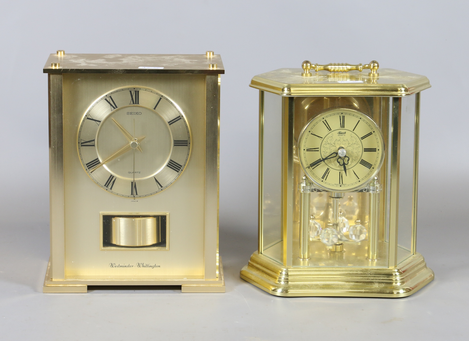 A Seiko quartz mantel clock with Westminster chime, a similar brass