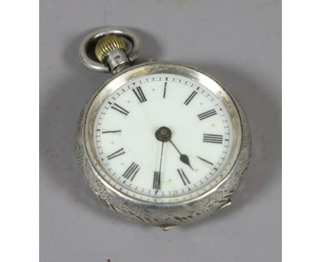 A small continental silver pocket watch with engraved decoration and enamel dial.