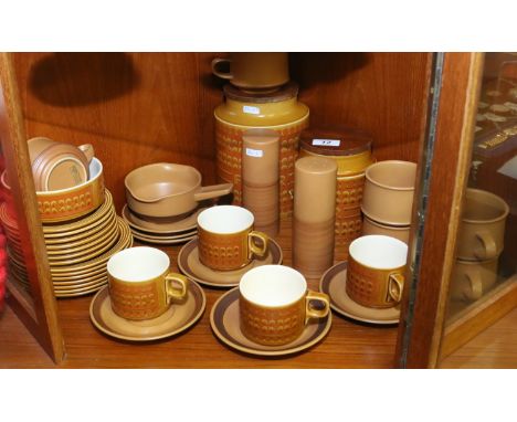 A collection of vintage Hornsea pottery along with a collection of Purbeck pottery to include storage jars, cups and saucers,