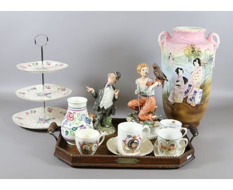 A collection of ceramics including two Capodimonte figures, a large twin handled mantel vase, Poole, commemorative wares, Mid