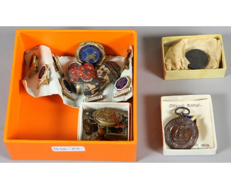 A collection of assorted enamel badges and brooches etc.