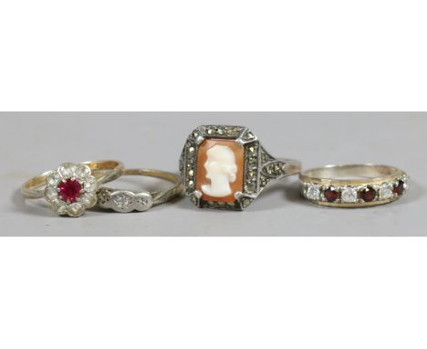 Four vintage silver and 9 carat gold dress rings including cameo and marcasite example.