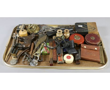 A tray lot of collectables to include tools, flatwares, old tin openers and nut crackers etc.