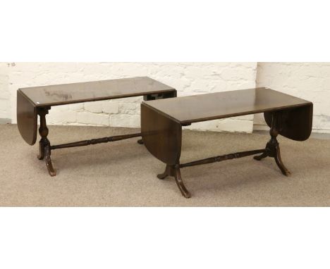 A pair of mahogany sofa tables.