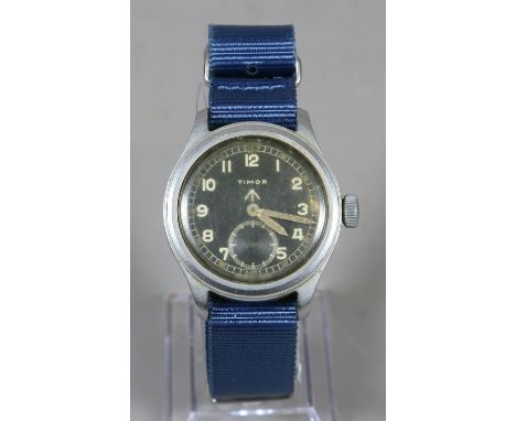 A rare World War II Timor issue 'Dirty Dozen' manual wristwatch. With black dial, luminous Arabic numeral markers, pointed ba