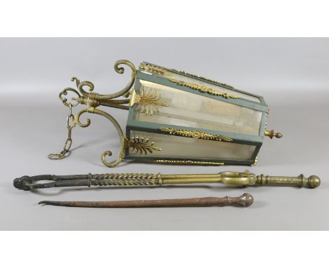 A gilt metal and painted tapering hexagonal hall lantern ornamented with anthemion.