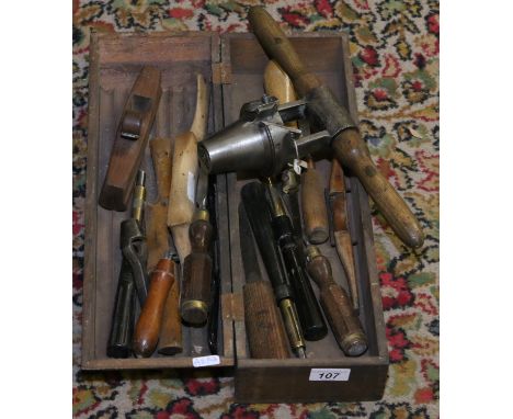 A collection of old tools including a Coopers barrel boring tool.
