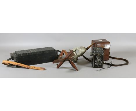 A stereoscopic viewer, cased camera and a collection of magic lantern slides.