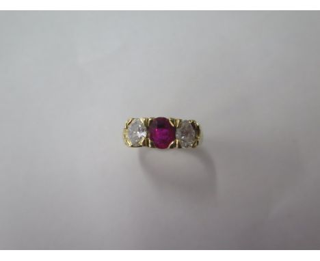 A yellow gold three stone ruby and diamond ring, each stone approx 0.25ct, diamonds bright and lively, ruby does have a chip 