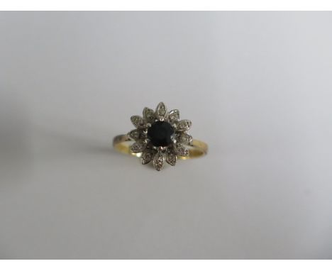 An 18ct yellow gold sapphire and diamond cluster ring, size O, approx 4.6 grams, in good condition 