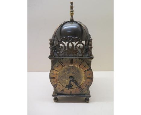 A Smiths brass lantern clock, 25cm tall with key, running 